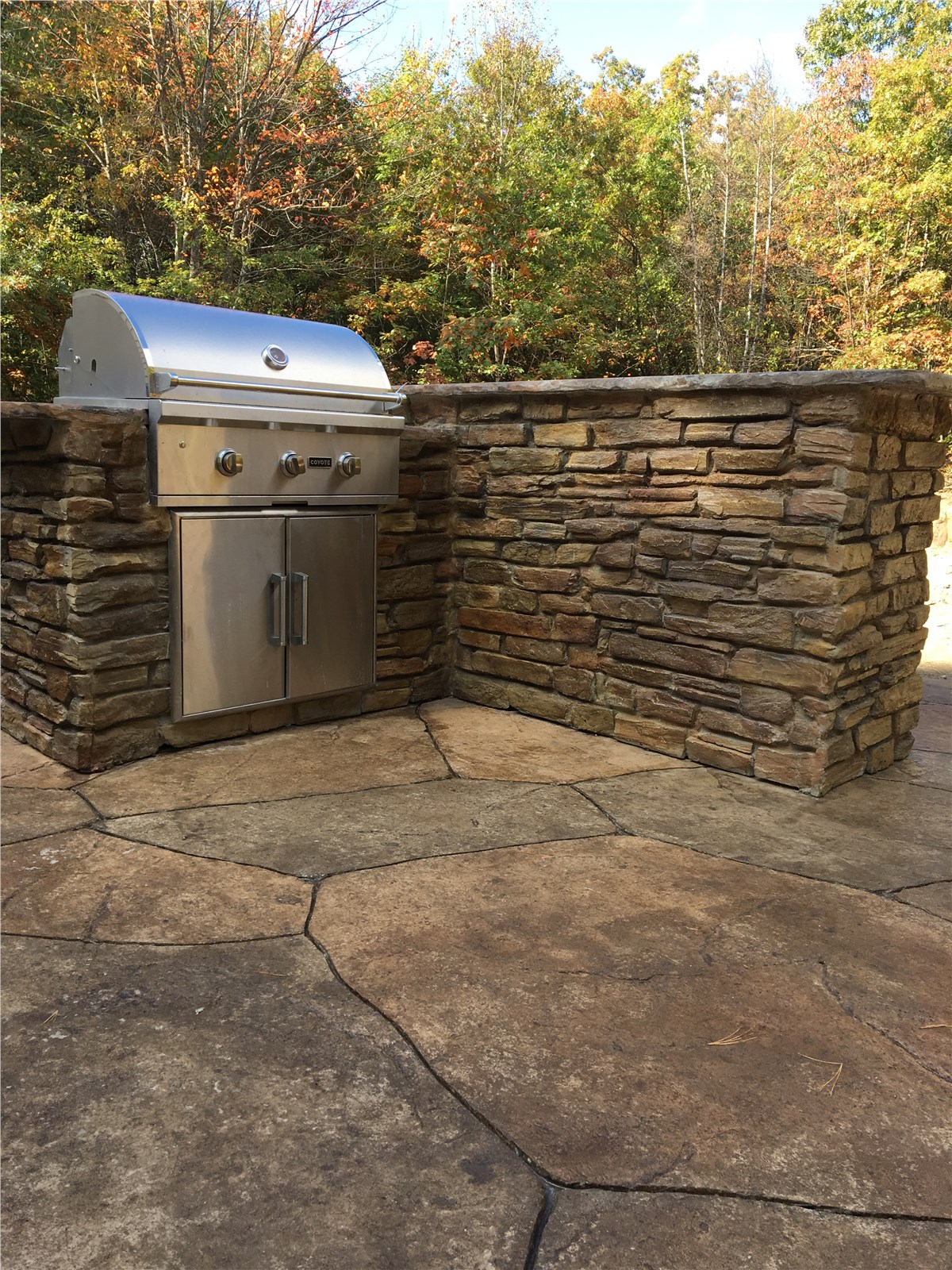 outdoor kitchen on paved patio